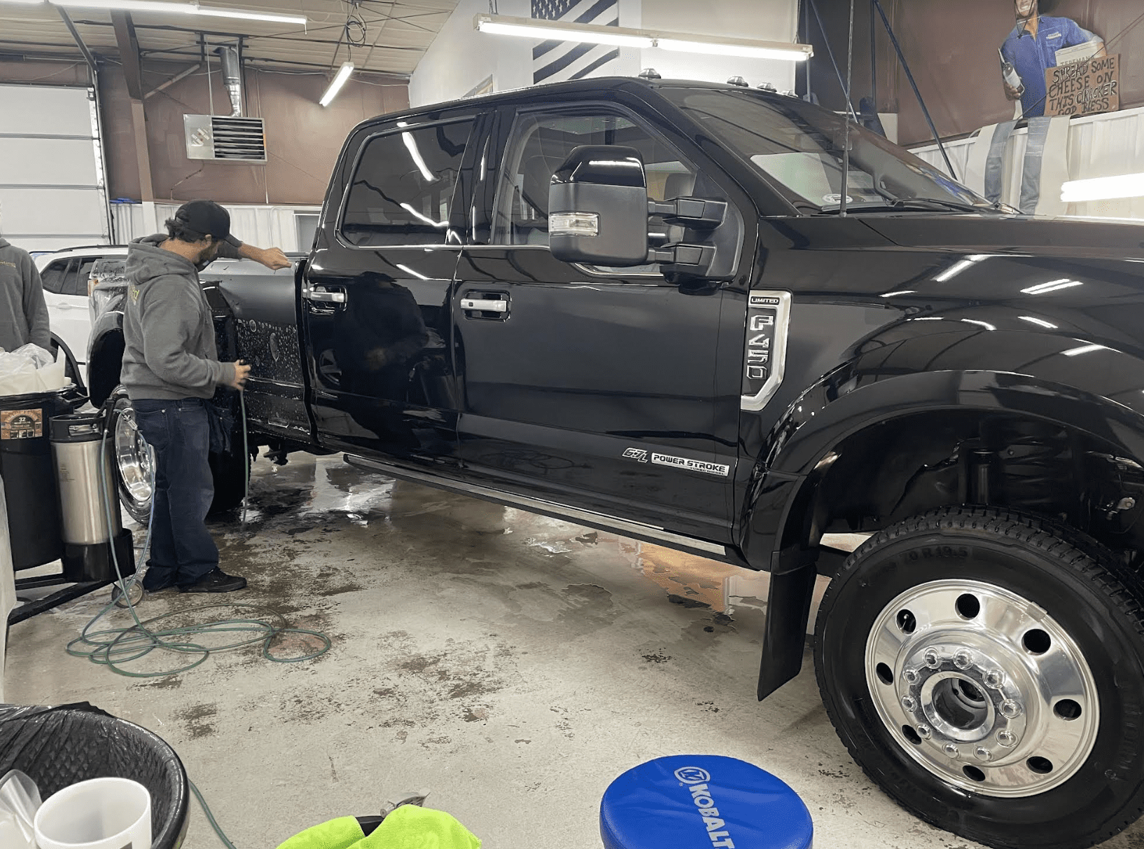 Preferred Window Tint owner putting paint protection film on truck
