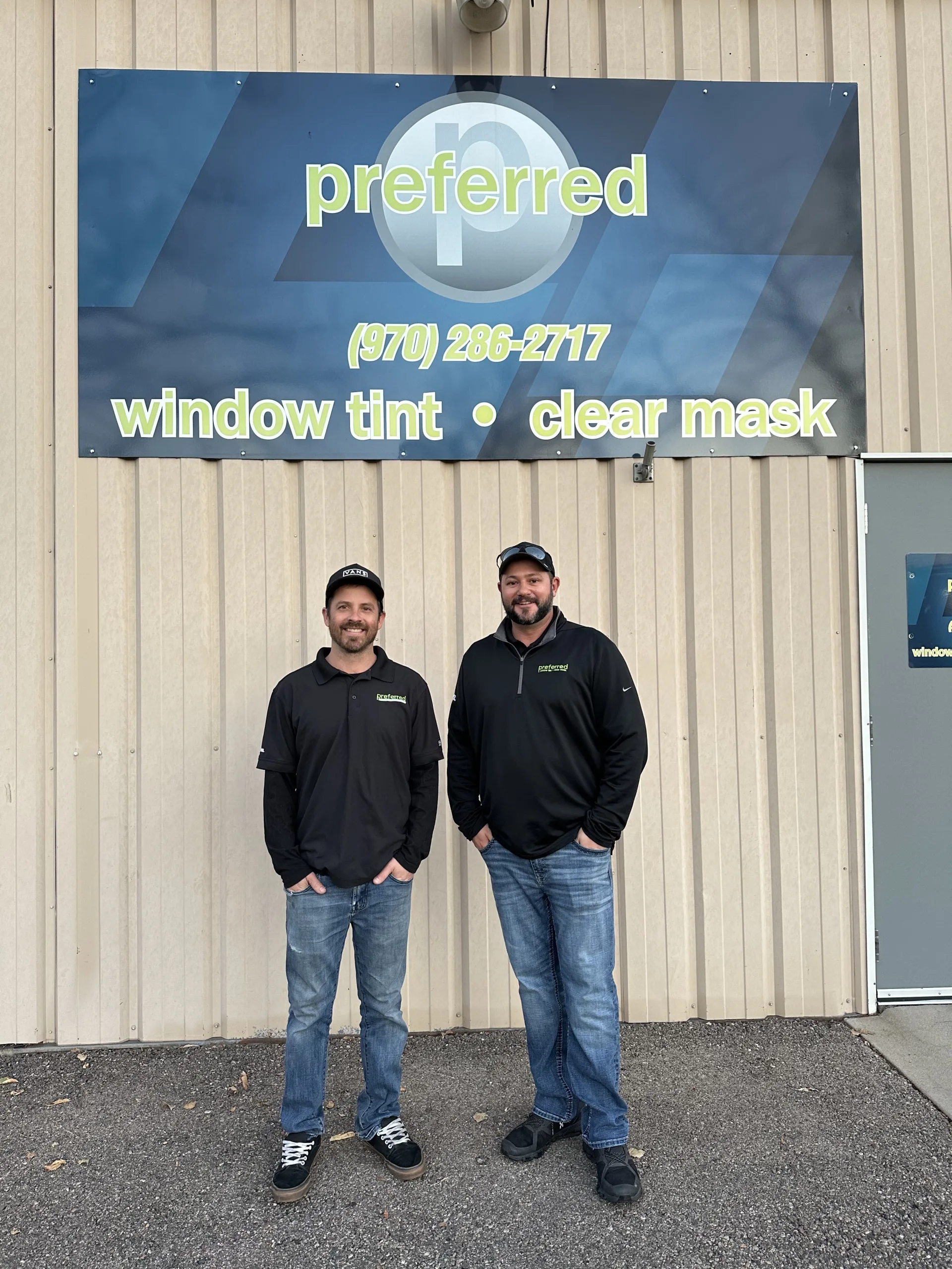 Preferred Window Tint Owners, Eric Smith and Zach Fulton in front of their shop